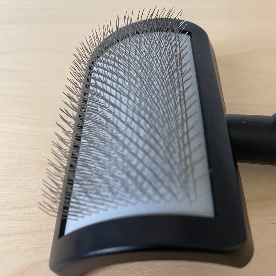 Curved slicker sales brush